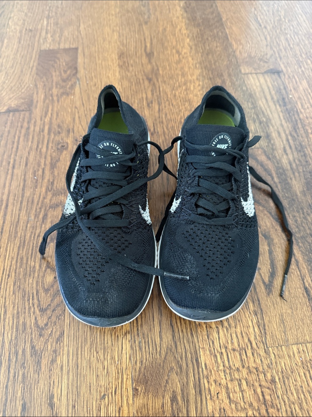 Nike Kid’s Black Athletic Running Shoes with White Swoosh